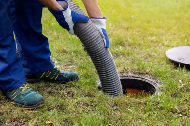 cleaning septic tank from technicians
